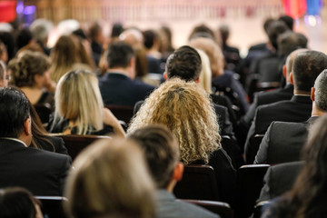 Women in the audience attending a conference - women targeted events.