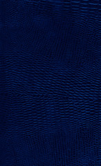 leather background textured with graining patterns toned in trendy Classic Blue color of the Year 2020