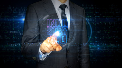 Businessman touch screen with Industry 4.0 hologram
