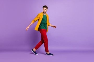 Fototapeta na wymiar Full length body size side profile photo of uncertain man unsure about what is going on in shoes going isolated violet pastel color background