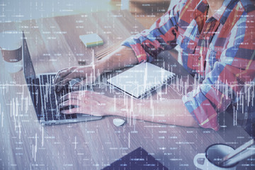 Multi exposure of forex graph with man working on computer on background. Concept of market analysis.