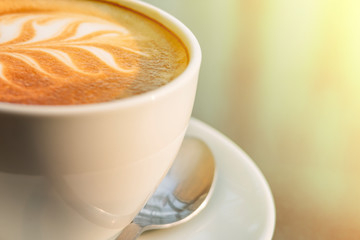 coffee photography close up selective focus at latte art coffee foam creamy in white coffee cup