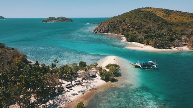 bangka boat resting at the blue Laguna in the ocean