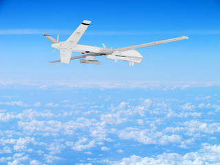 Fototapeta na wymiar military UAV airplane drone flies against backdrop of beautiful clouds on blue sky background