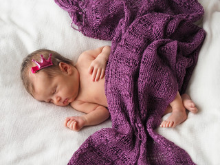 Newborn. Photoshoot of a newborn. Newborn girl is sleeping. Little Princess.