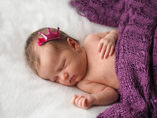 Newborn. Photoshoot of a newborn. Newborn girl is sleeping. Little Princess.