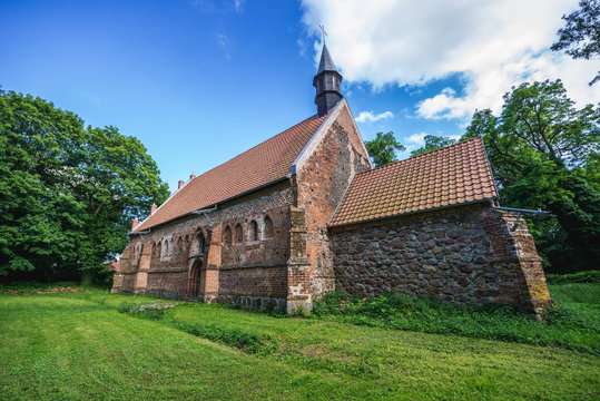 Old bricks and stones church from XIV century in small village Chlebowo, Poland