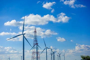 Fototapeta premium Wind turbine with blue sky. Wind energy. Clean energy