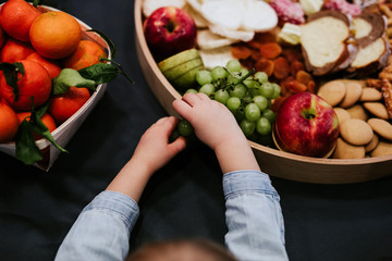 Child Hands Hold Assortment Fresh Organic Fruit Background Country Style. Local Garden Produce Clean Food Eating Dieting Toned