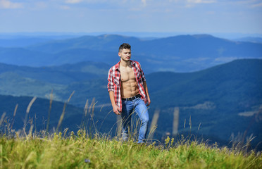 best vacation. countryside concept. farmer on rancho. man on mountain landscape. camping and hiking. sexy macho man in checkered shirt. travelling adventure. hipster fashion. cowboy in hat outdoor