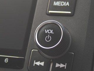 Volume and power button on car stereo entertainment system