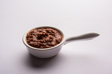 Homemade Tandoori Paste or Marinade mixture, in a bowl. used for grilled chicken or Paneer or vegetable. selective focus