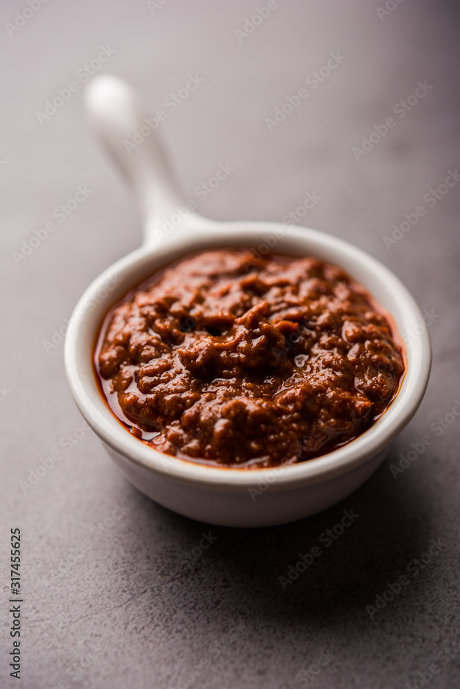 Wall mural Homemade Tandoori Paste or Marinade mixture, in a bowl. used for grilled chicken or Paneer or vegetable. selective focus