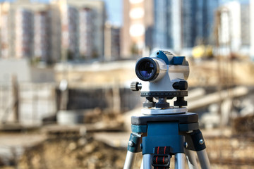 Surveyor equipment GPS system or theodolite outdoors at highway construction site.Measuring...