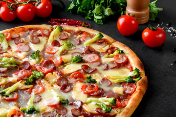 pizza with broccoli and sausages