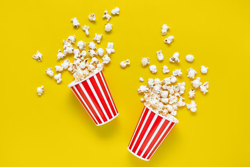 Top view on two red paper cups with popcorn