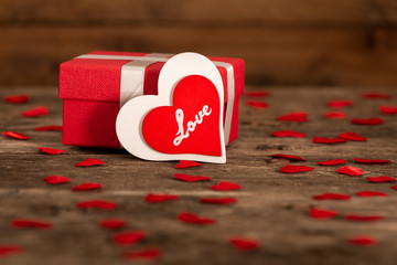 Valentine's day greeting card for love with red and white heart shape and gift box on wooden background - 317457499