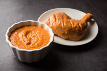 Homemade Tandoori Paste or Marinade mixture, in a bowl. used for grilled chicken or Paneer or vegetable. selective focus