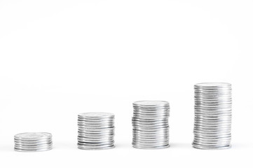 A stack of coins in ascending order. Profit growth concept. The economic growth. On white...
