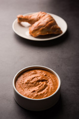 Homemade Tandoori Paste or Marinade mixture, in a bowl. used for grilled chicken or Paneer or vegetable. selective focus