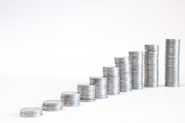 A stack of coins in ascending order. Profit growth concept. The economic growth. On white...