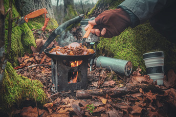 Cook on a hiking trip with a backpack.