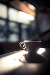 Steamy coffee cup in the sunlight