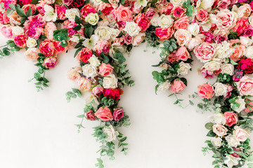 Flower pattern made of pink, beige roses flower buds on white background. Flat lay, top view. © K.Decor