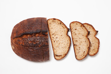 Loaf of sliced artisan bread shot from above.