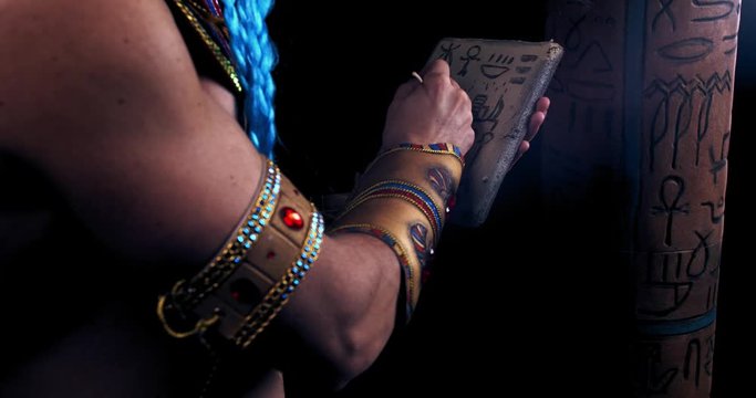 Egyptian deity Thoth is writing hieroglyphics on a stone, near a column, 4k