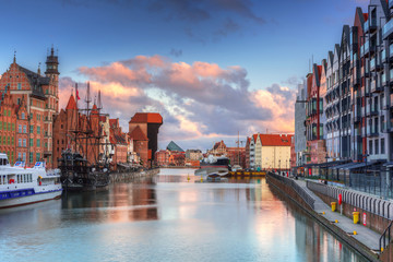 Beautiful scenery of the old town in Gdansk over Motlawa river at sunrise, Poland. © Patryk Kosmider