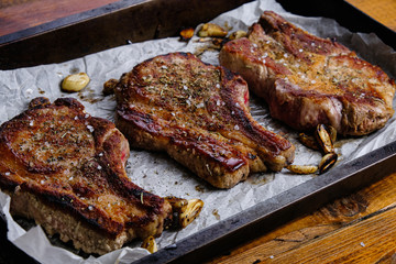 roasted pork loin with ribs on a wooden background