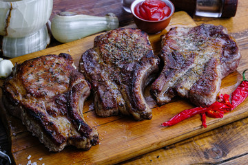 roasted pork loin with ribs on a wooden background
