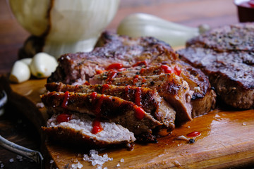 roasted pork loin with ribs on a wooden background