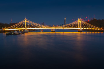 Fototapeta na wymiar Long exposure, illuminated Albert bridge in London
