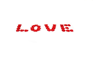 Word love with colored beads on white background