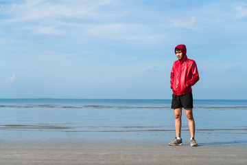 A male boxer practicing boxing at beach