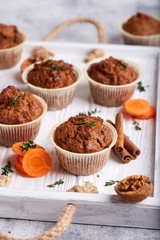 Muffins with carrot, walnuts and cinnamon. Delicious homemade appetizer. 