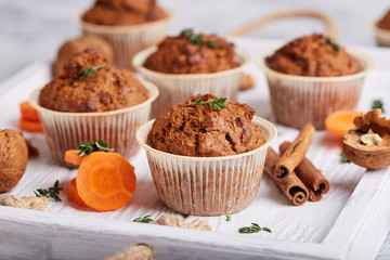 Muffins with carrot, walnuts and cinnamon. Delicious homemade appetizer.  - Powered by Adobe