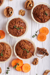 Muffins with carrot, walnuts and cinnamon. Delicious homemade appetizer. Top view.