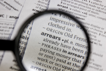 Fototapeta premium Arrears word or phrase in a dictionary.