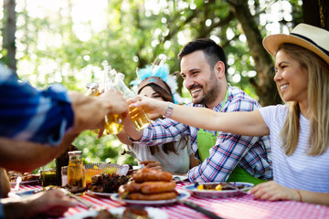 Small group of friends having fun at barbecue party