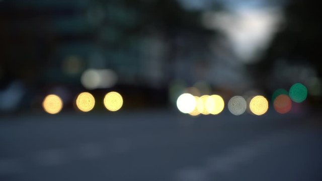 Blurry bokeh view of city traffic in the evening