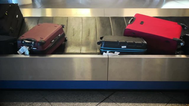 4k footage of suitcase or luggage with conveyor belt in the international airport.