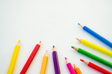 Coloured pencil pattern on white background. Colourful pencil seamless pattern.