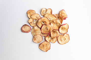 Pile of apple natural chips on white background