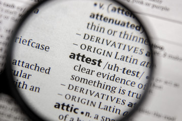 The word or phrase attest in a dictionary.