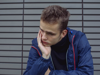 Portrait of a sad, tired, depressed teenager. Problems of teenagers, concept