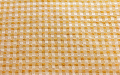 Trendy beige material in cage as background