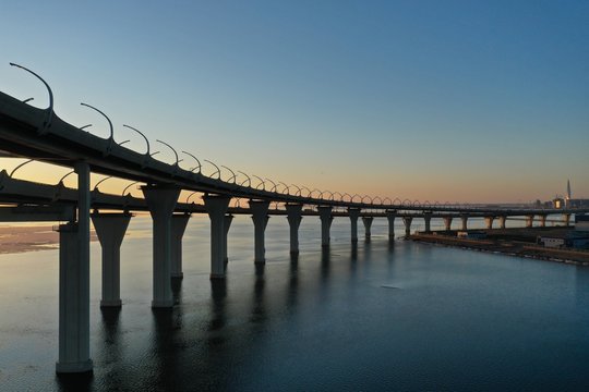 Two-story ZSD Highway and Traffic Cars over the Sea and Sunset Saint-Petersburg, Russia